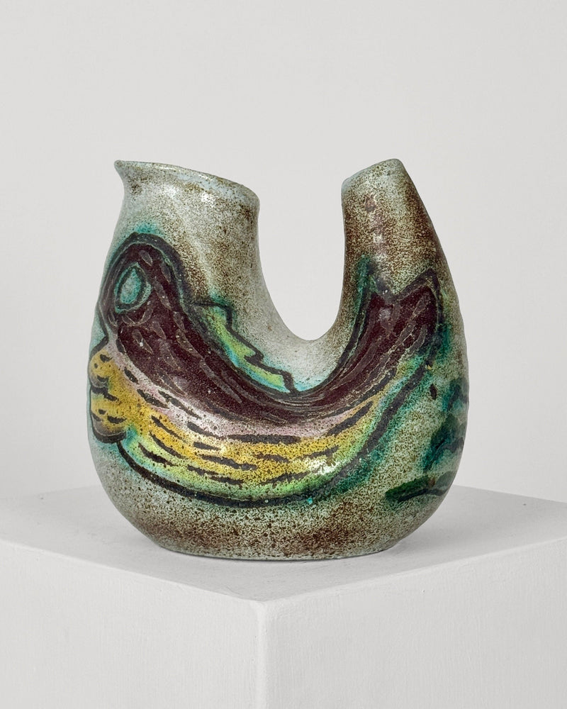 Zoomorphic ceramic vase detail showing curved form and glazed finish