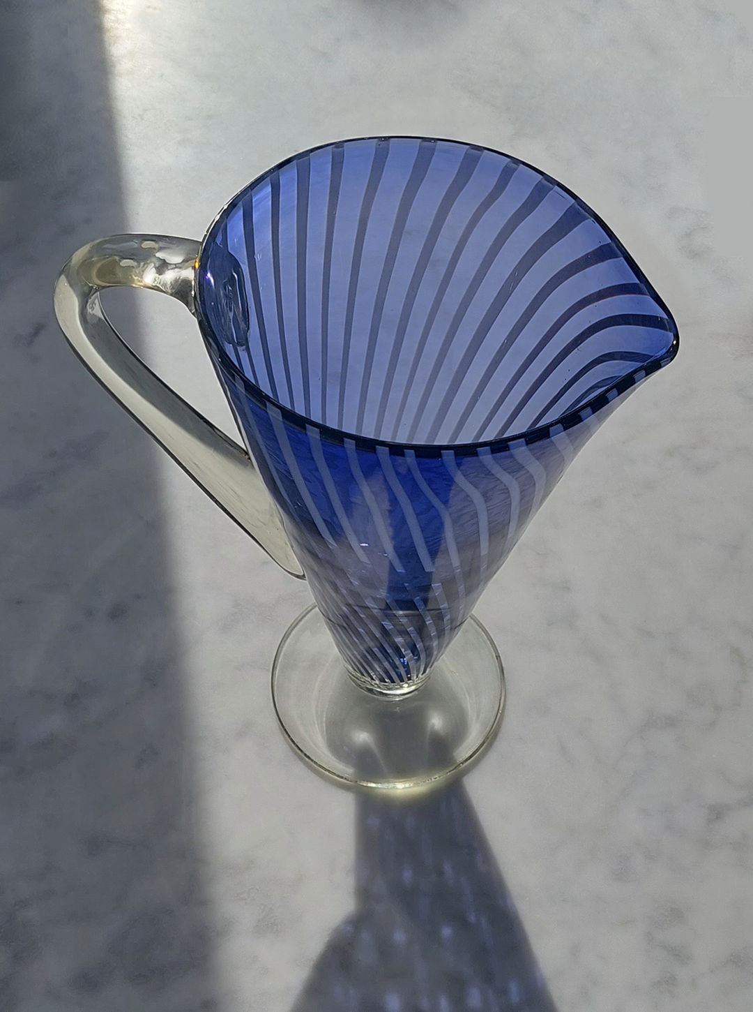  Artisan-crafted Murano glass pitcher featuring vibrant stripes and sleek design