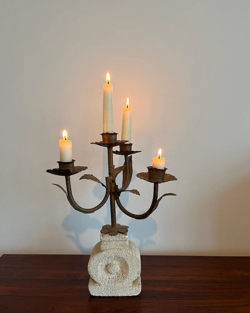 French Luberon wrought iron candelabra on stone base with lit candles