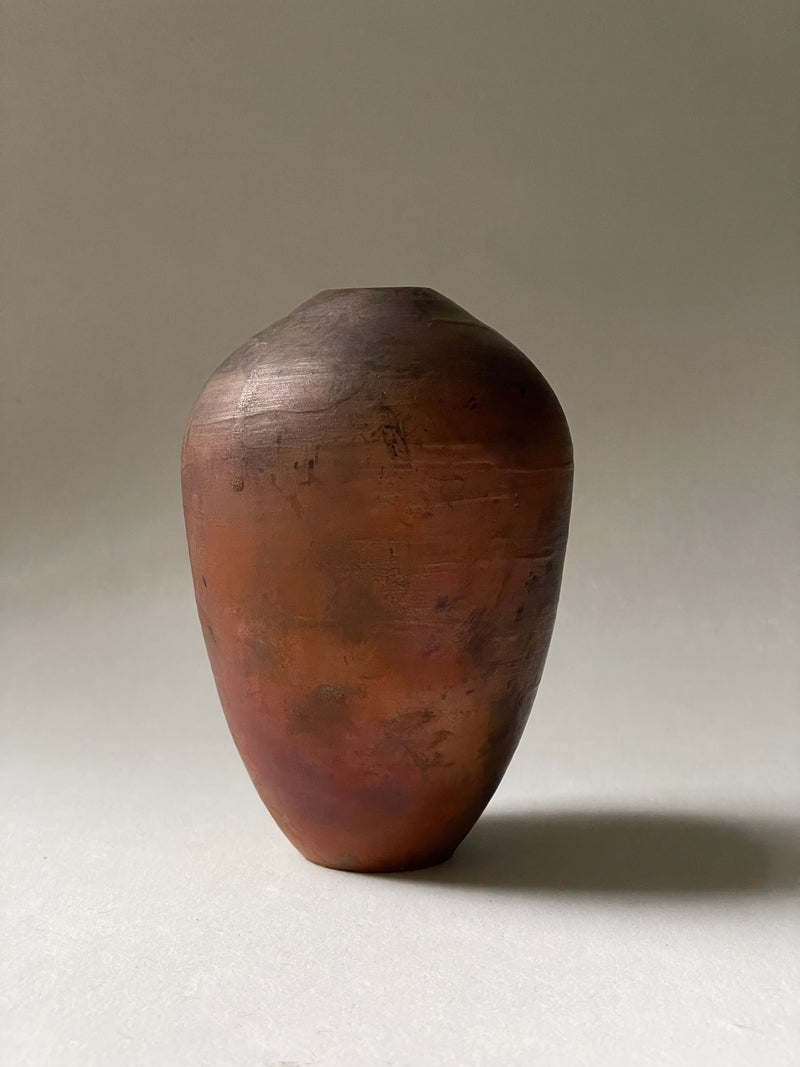 Handmade ceramic vase with rustic earth-toned glazed finish