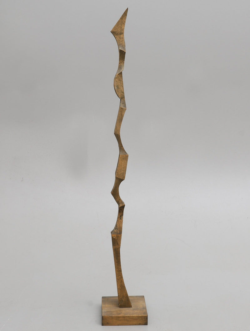 Tall biomorphic wooden sculpture with angular carved segments by Kristian Holmqvist