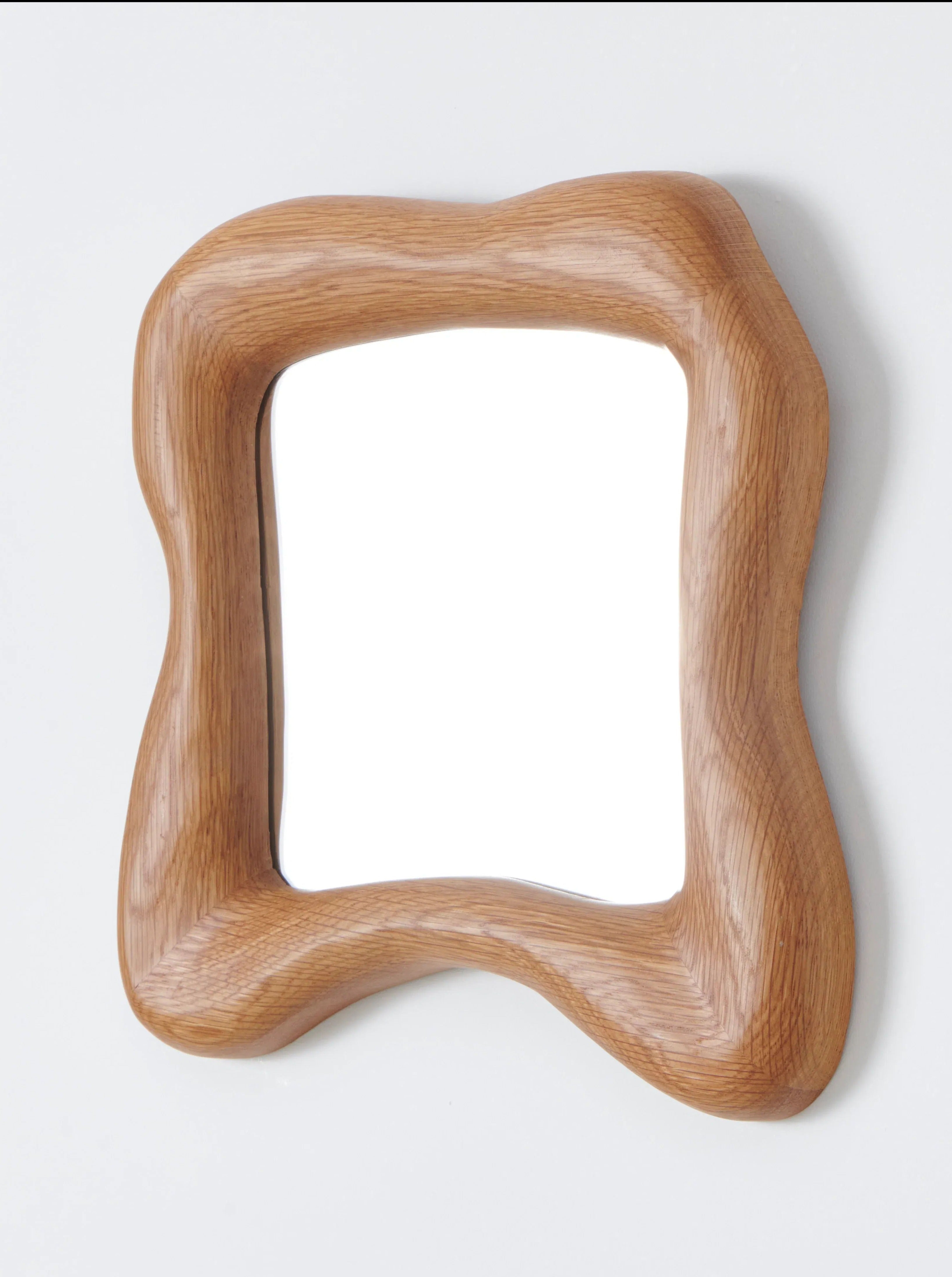 Handcrafted wooden frame Minho Mirror reflects natural light beautifully 