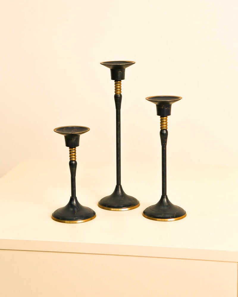 Set of three vintage blue metal candlesticks with gold accents