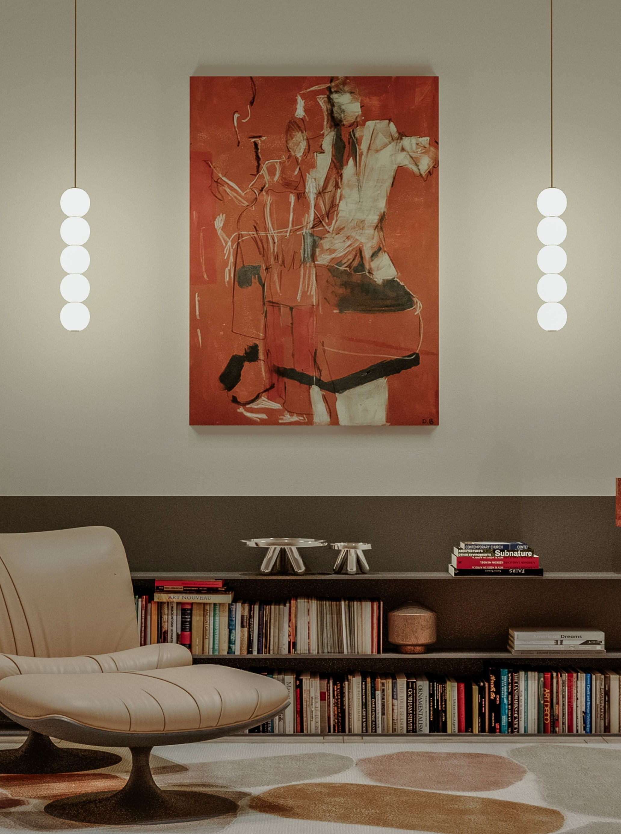 A modern living room featuring a beige lounge chair with a matching ottoman, a low bookshelf filled with books, and an exclusive piece of abstract red and white acrylic artwork by Dovile Bernotaite titled "Couple - Acrylic, oil pastel, charcoal on canvas" hanging on the wall. Two pendant lights with multiple spherical bulbs are suspended on either side of the artwork.