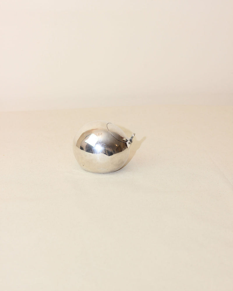 Chrome-plated Space Age ashtray with spherical design and hinged lid