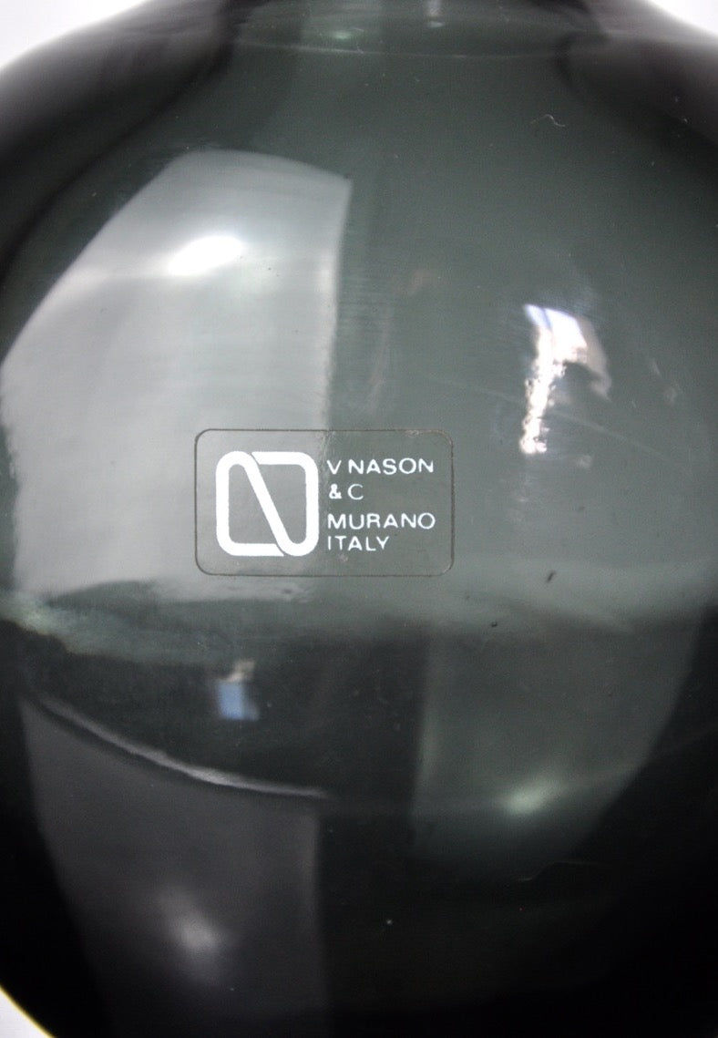 A close-up of a black Murano glass vase by Vincenzo and Carlo Nason (Malamar Studio, Italy, 1960) features a label with the stylized "N" logo, highlighting the refined Italian art glass craftsmanship.