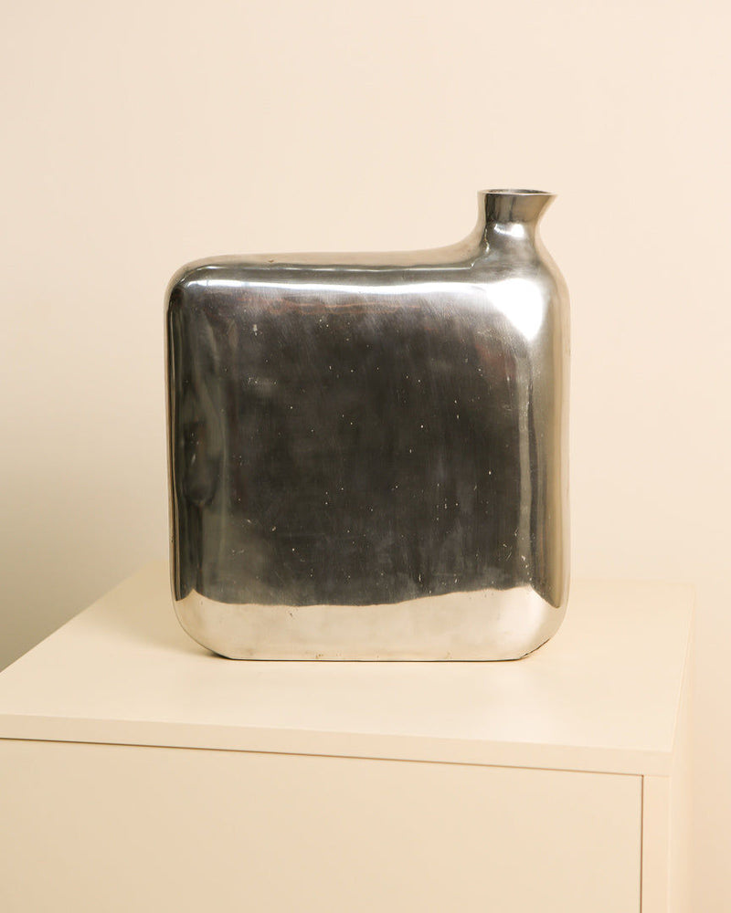Sculptural aluminum vase with curved rectangular form, 1980s design