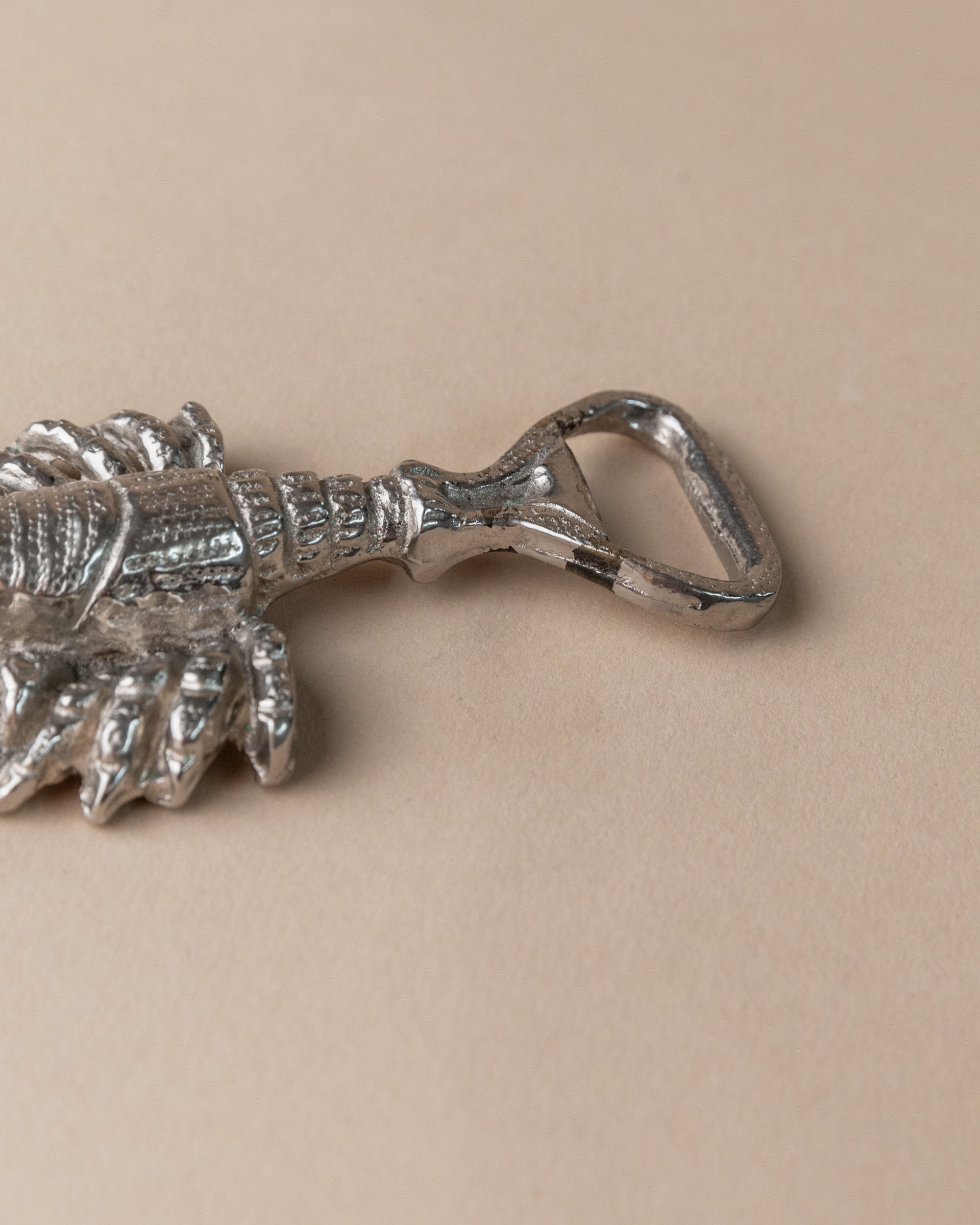 Silver plated bottle opener with decorative handle detail, Italy 1960s