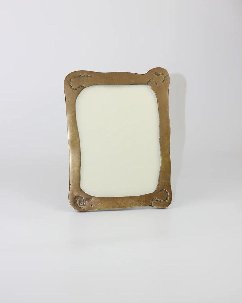Against a white backdrop, the Brutalist Mirror by Boga Avante Shop stands upright, its minimalist charm accentuated by a blank space for reflection. Slightly wavy edges and subtle corner engravings merge timeless elegance with contemporary simplicity.