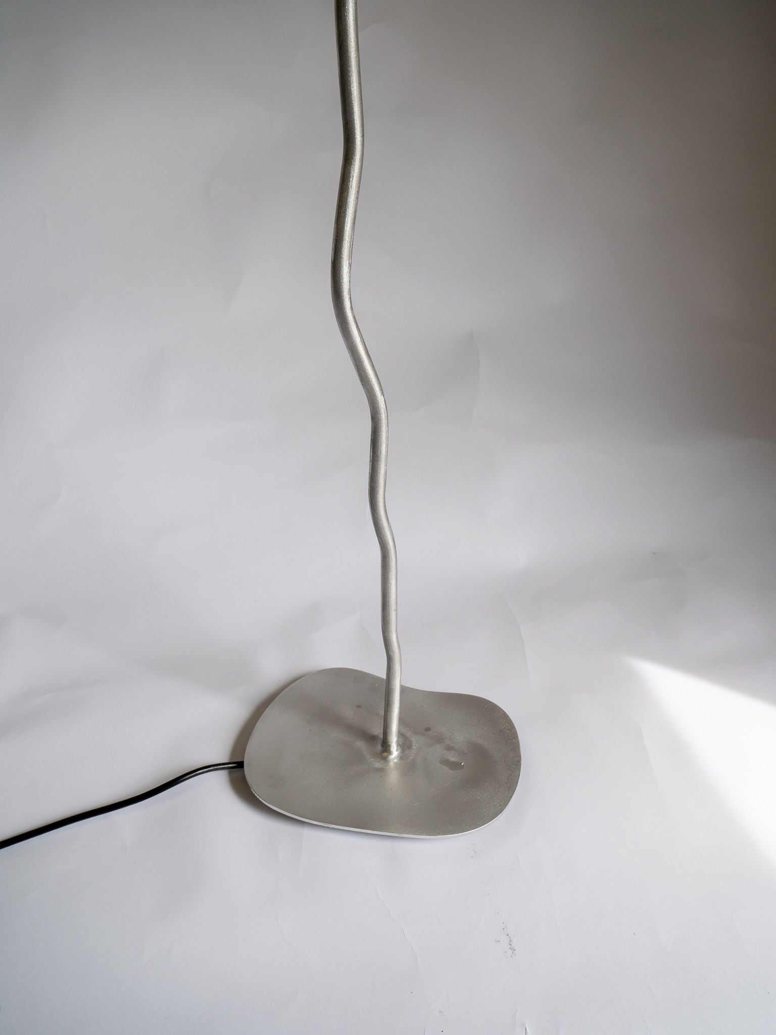 Contemporary lighting fixture with long, flexible neck and metal base