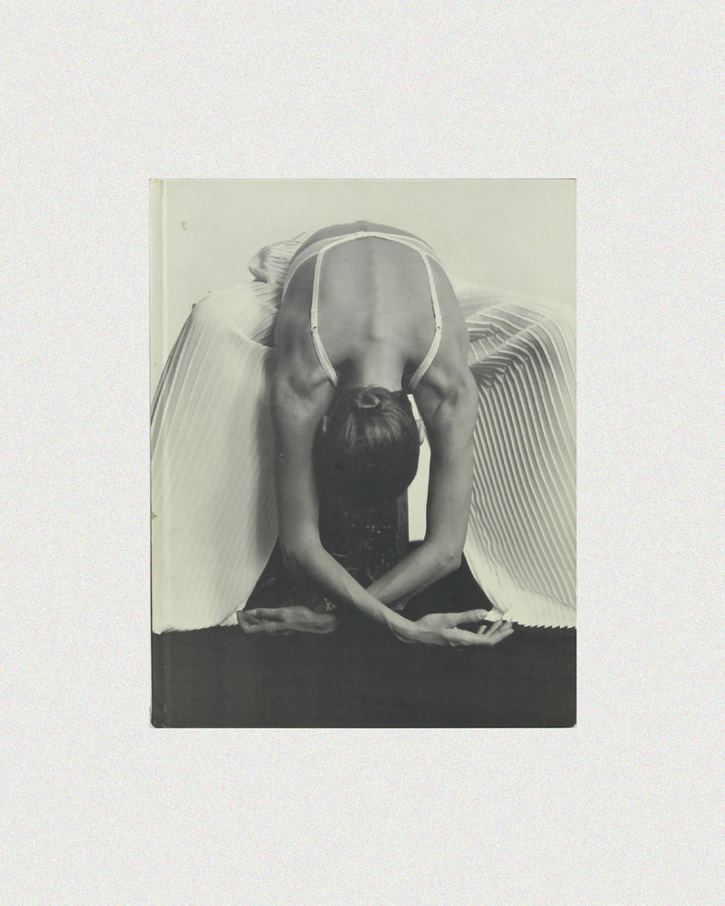 Black and white artistic photography book cover featuring dramatic pose