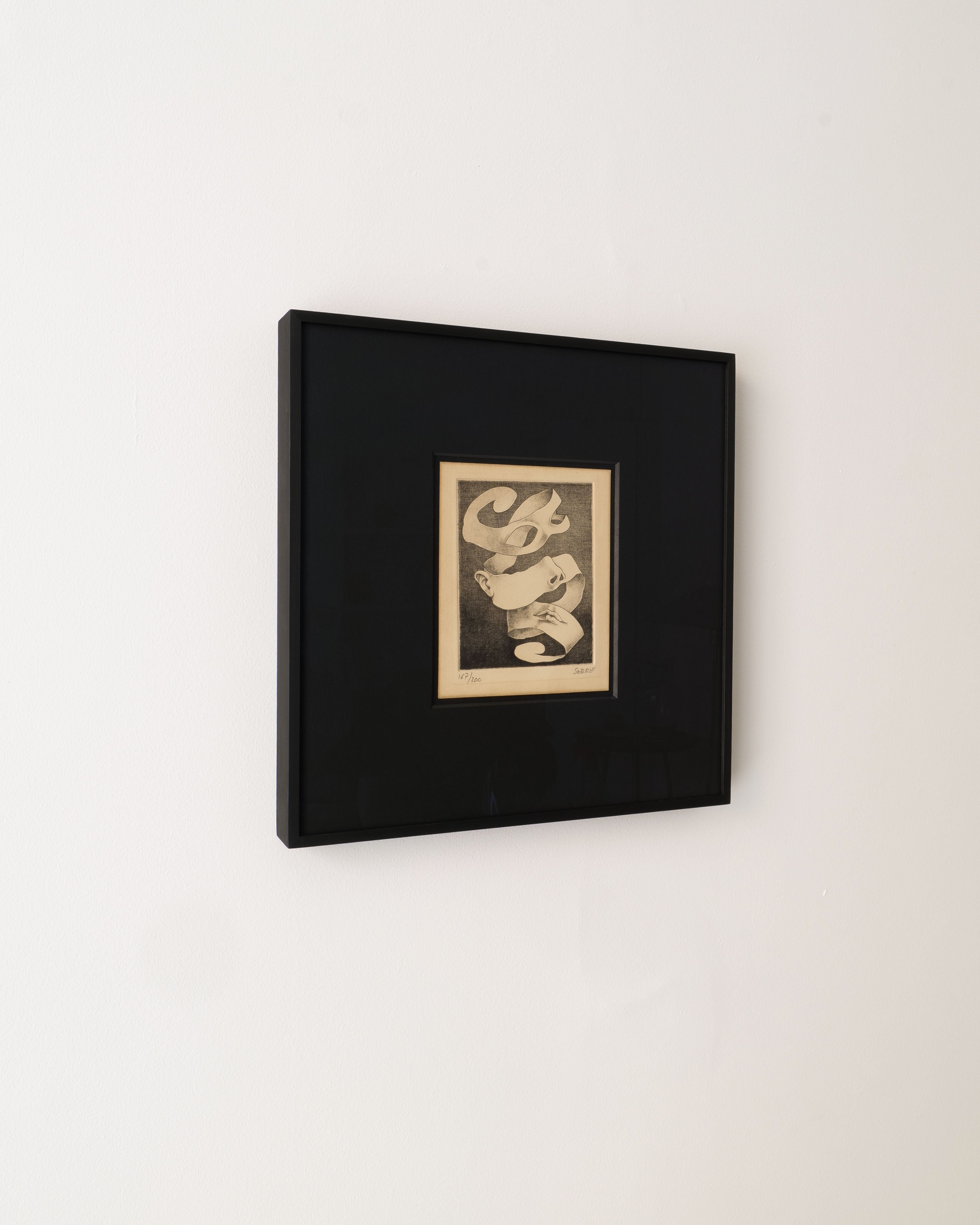 A framed Surrealist Engraving by Claude Serre (1938-1998) from Collection apart, featuring an abstract ribbon-like design in black and white, hangs on a plain white wall, evoking the style of French satirical illustrations.