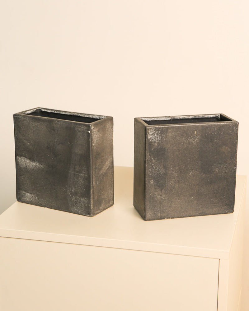 Pair of dark metallic Italian vases from the 1980s on shelf