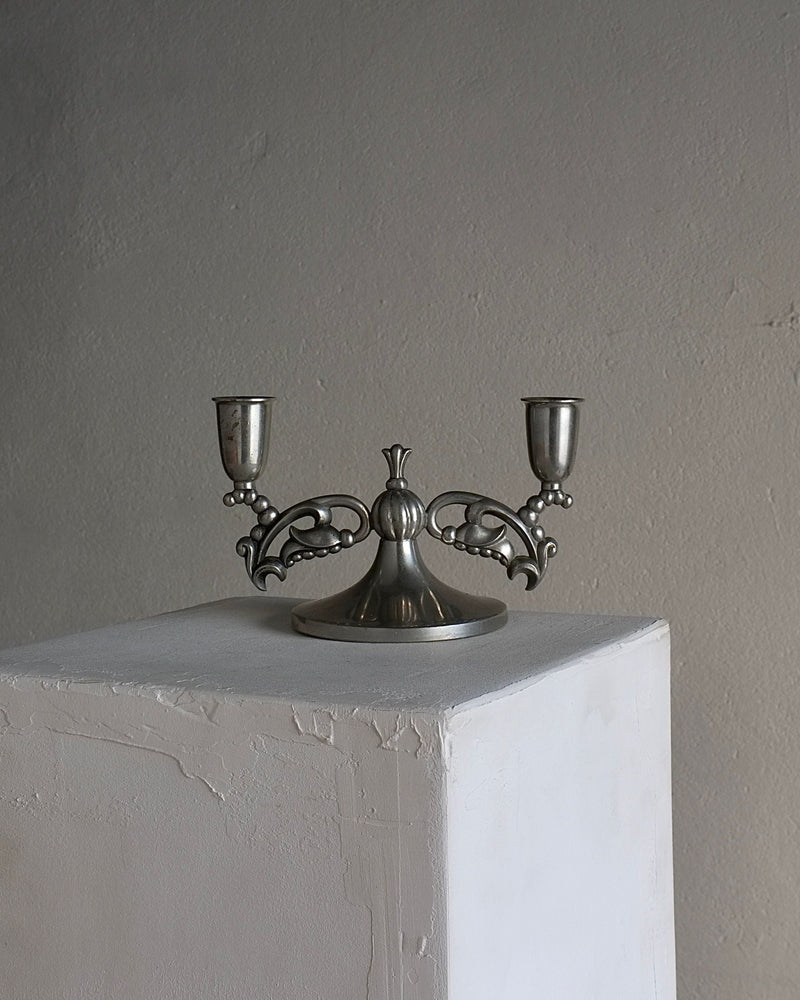 Swedish Grace pewter candleholder with ornate scrollwork arms, 1930s