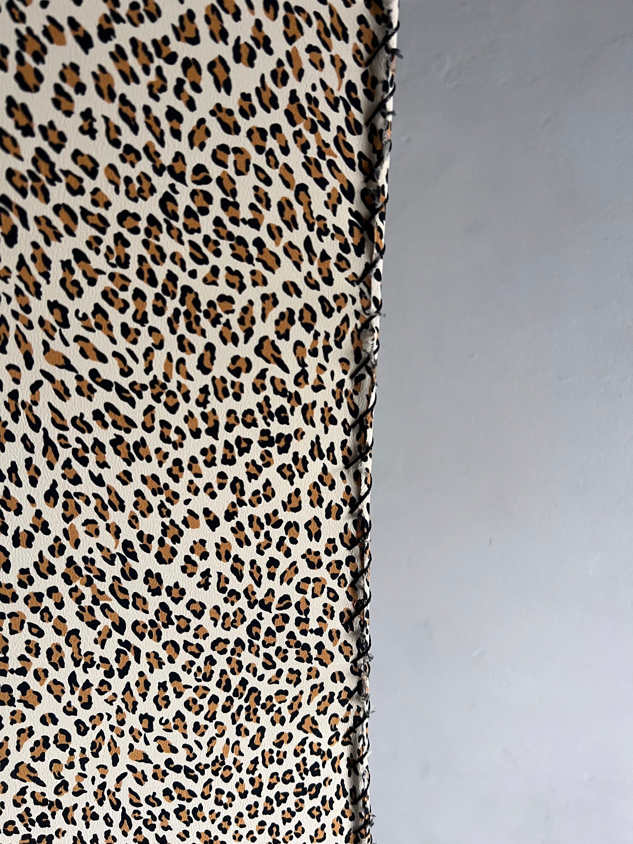 The Veter Vintage "Leopard Print Floor Lamp, 1980s" features a brown, black, and beige leopard print pattern beside a plain light gray wall and a vintage base.