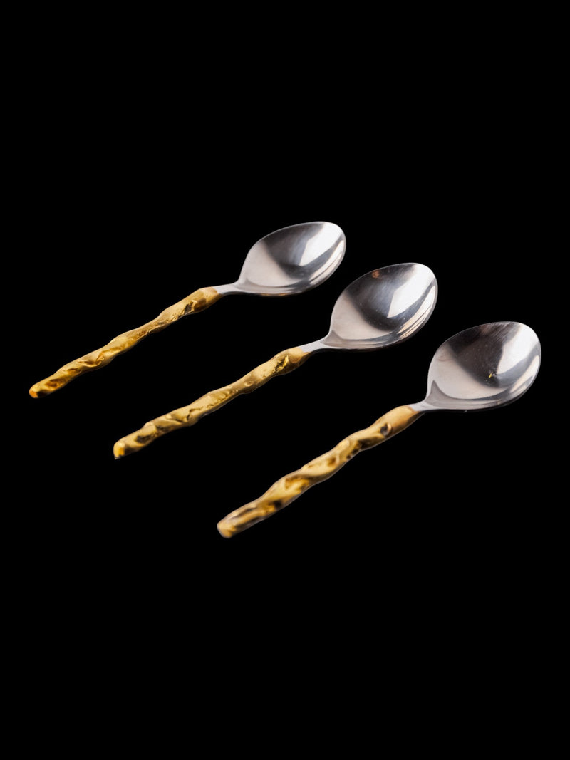 Set of three brutalist teaspoons with golden textured handles