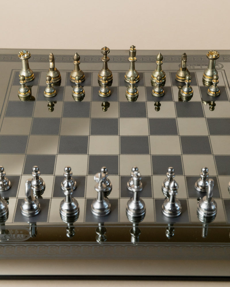 Mirrored chessboard with metallic pieces detail view Italy 1980s