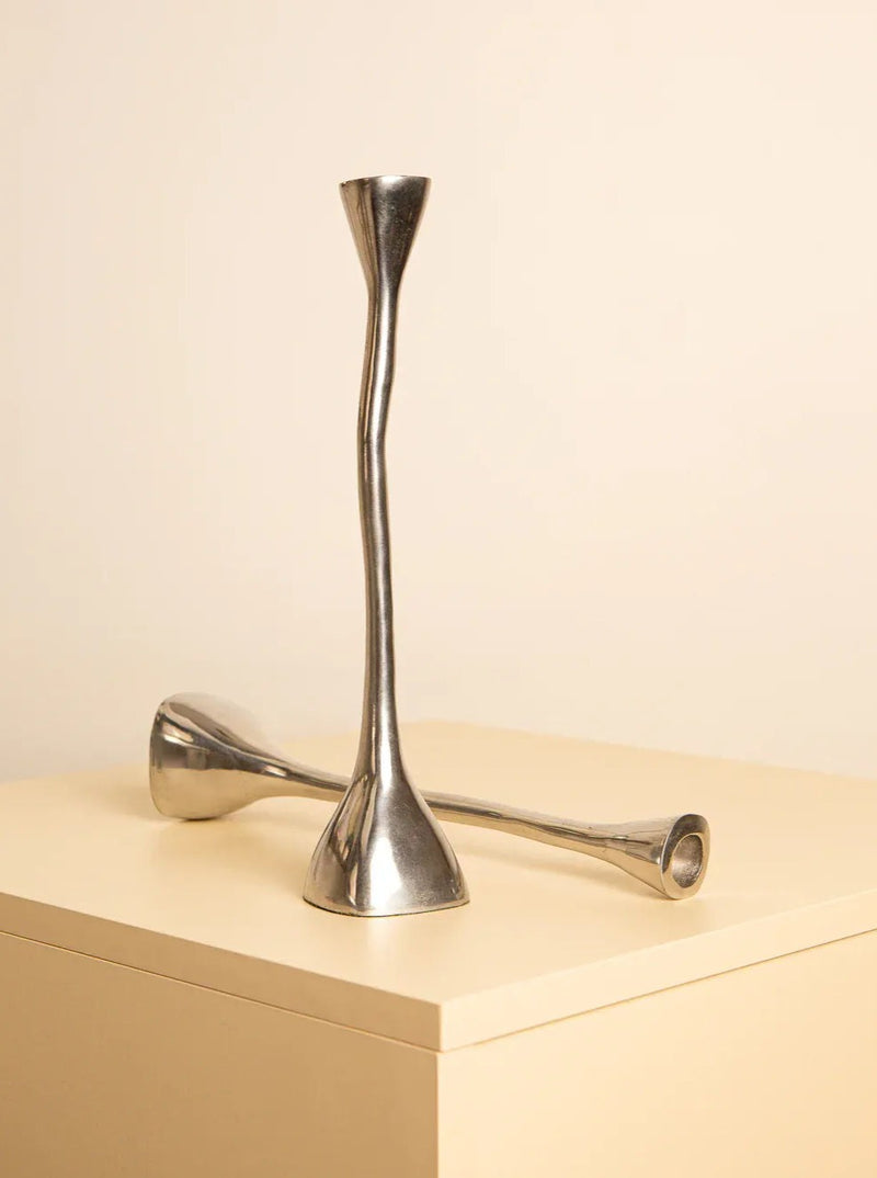 Shiny silver candle holders with a retro look from the 1980s