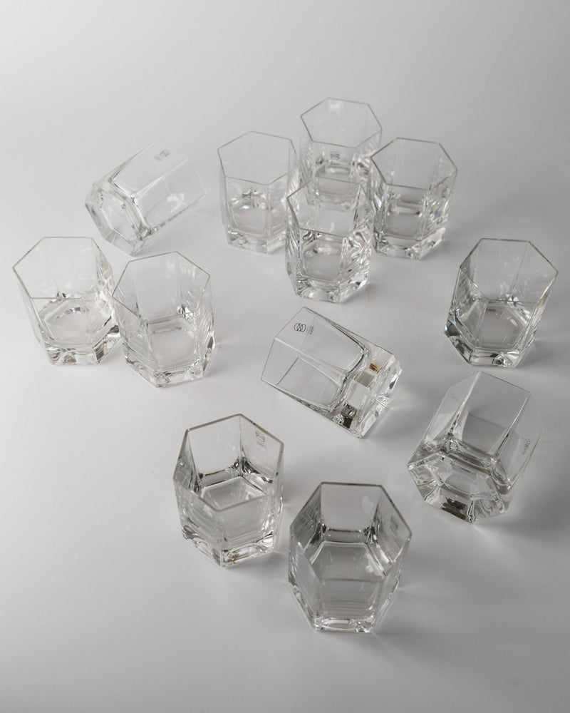 Clear crystal hexagonal drinking glasses scattered arrangement by Europa Cristalleria
