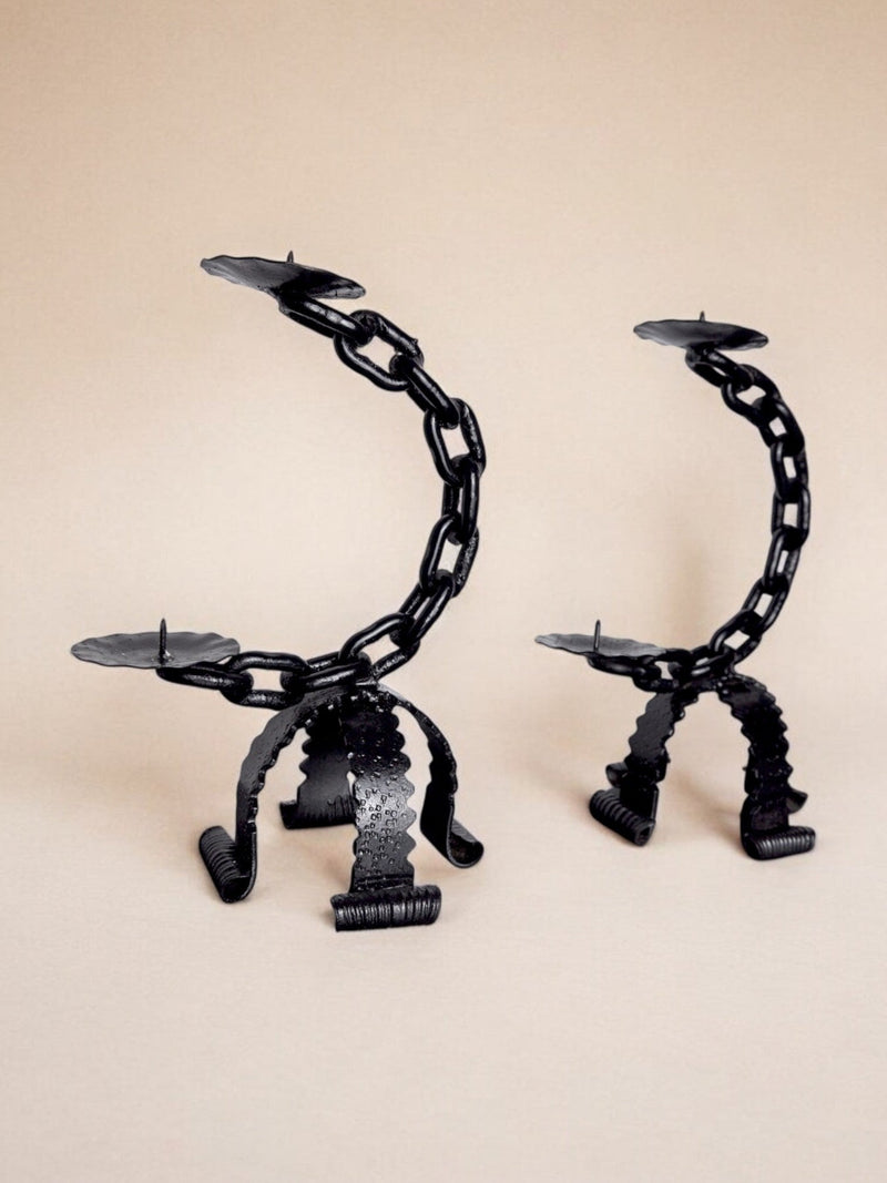 Two black brutalist chain candleholders with sculptural legs, Italy 1960s