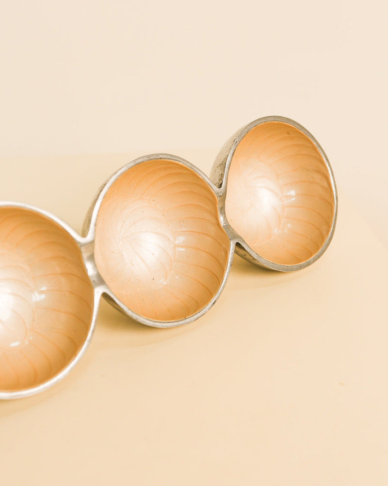 Three interconnected orange aluminum bowls of Galassia vide-poche set