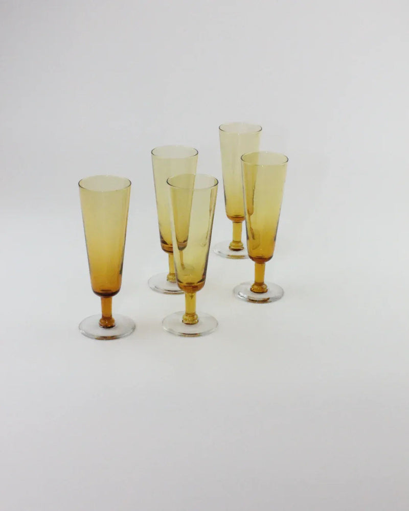 Set of 5 amber crystal champagne flutes with golden stems