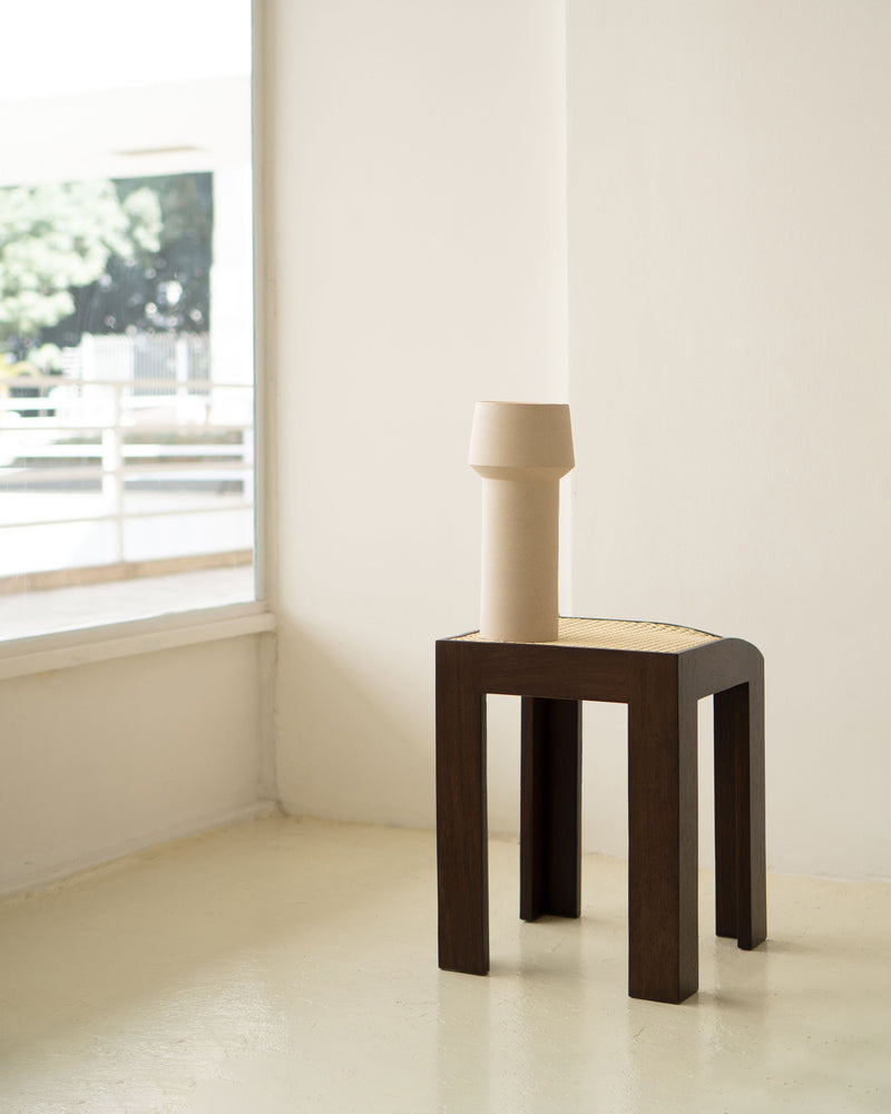 Canto wooden stool with cane seat by Andre Grippi lifestyle view
