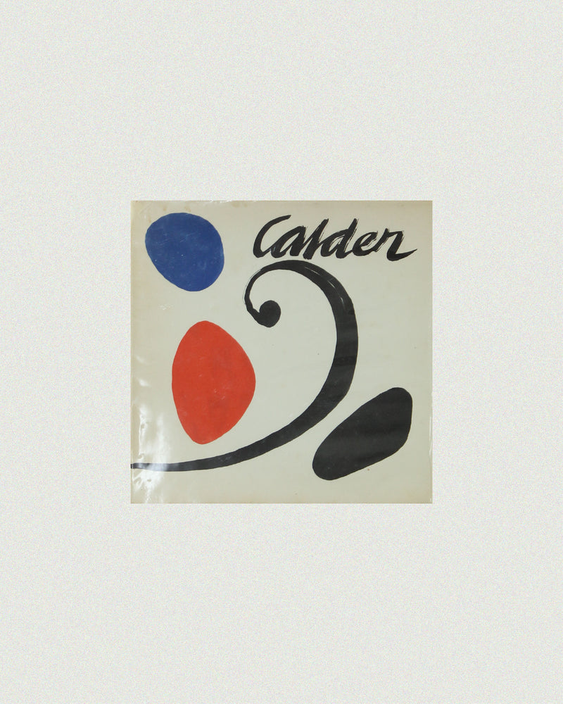 Calder art book cover with abstract blue red black shapes