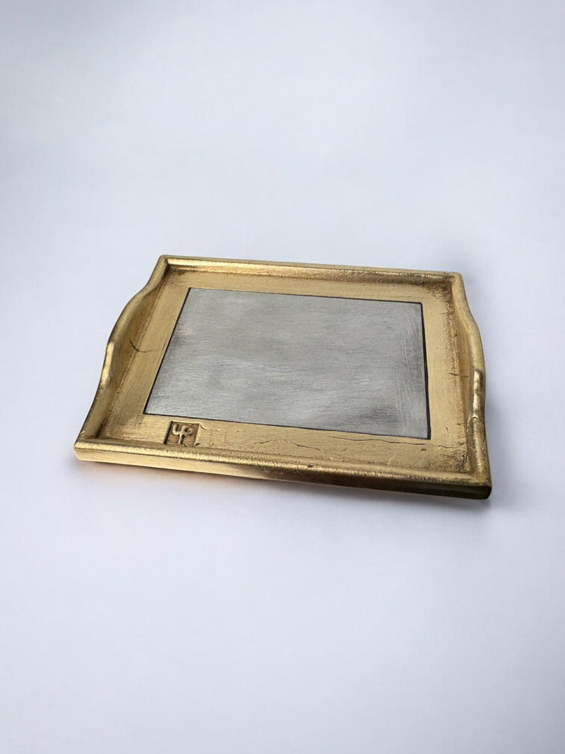Brutalist gold-framed vide-poche with brushed metal surface by David Marshall