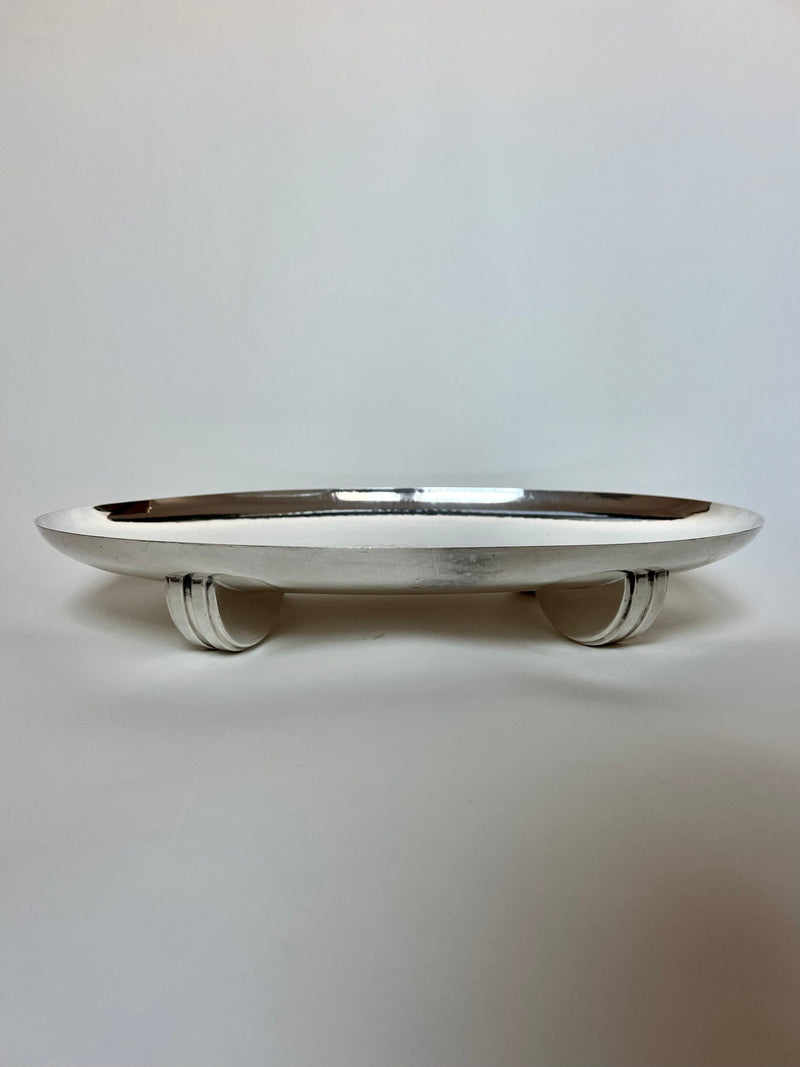 Polished silver Art Deco serving plate with curved handles