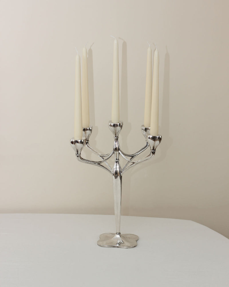 Five-arm nickel silver candelabra with white tapered candles