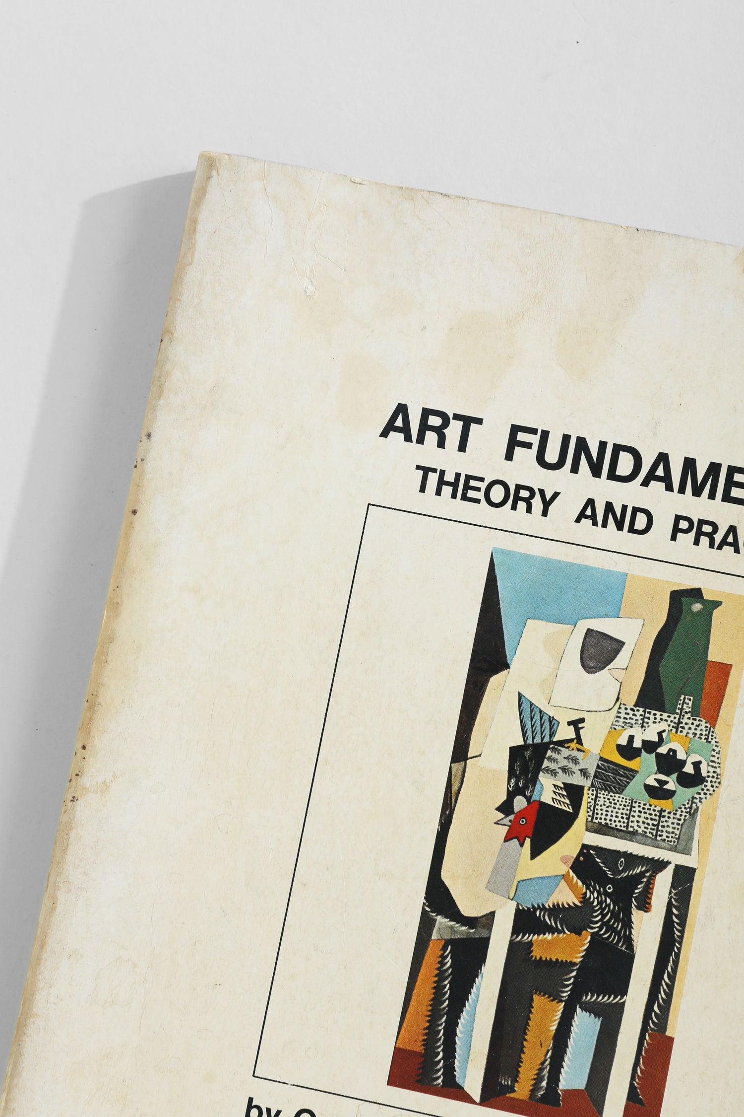 A close-up of Villa’s 'Art Fundamentals' book cover displays geometric, abstract artwork in vibrant colors, with only the top left portion of this classic art guide visible.