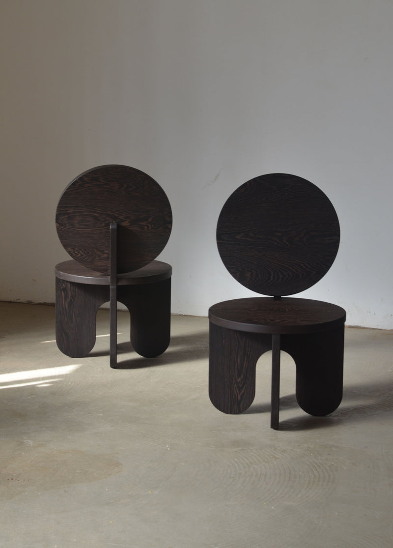 Dark oak solid wood chairs with circular backrests, modern design