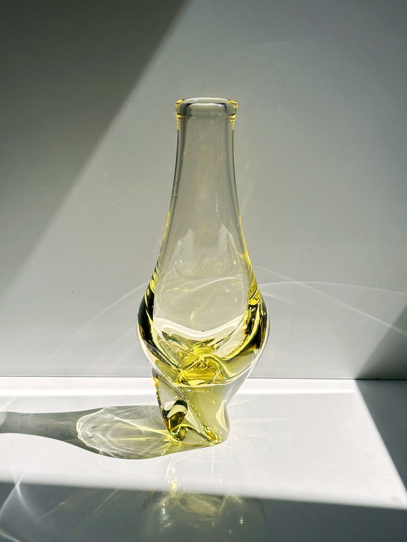 Melting citrine glass vase detail showing flowing organic form