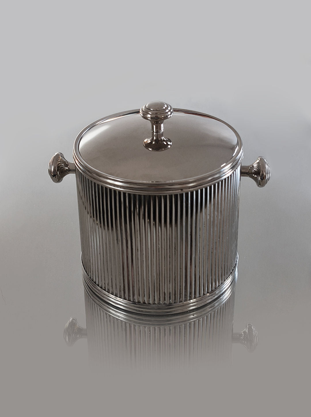 Silver plated ice bucket with ribbed texture and lid