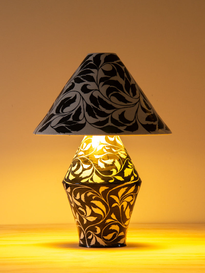 Paisley table lamp with black botanical pattern on illuminated base by Gordon Moore Studio