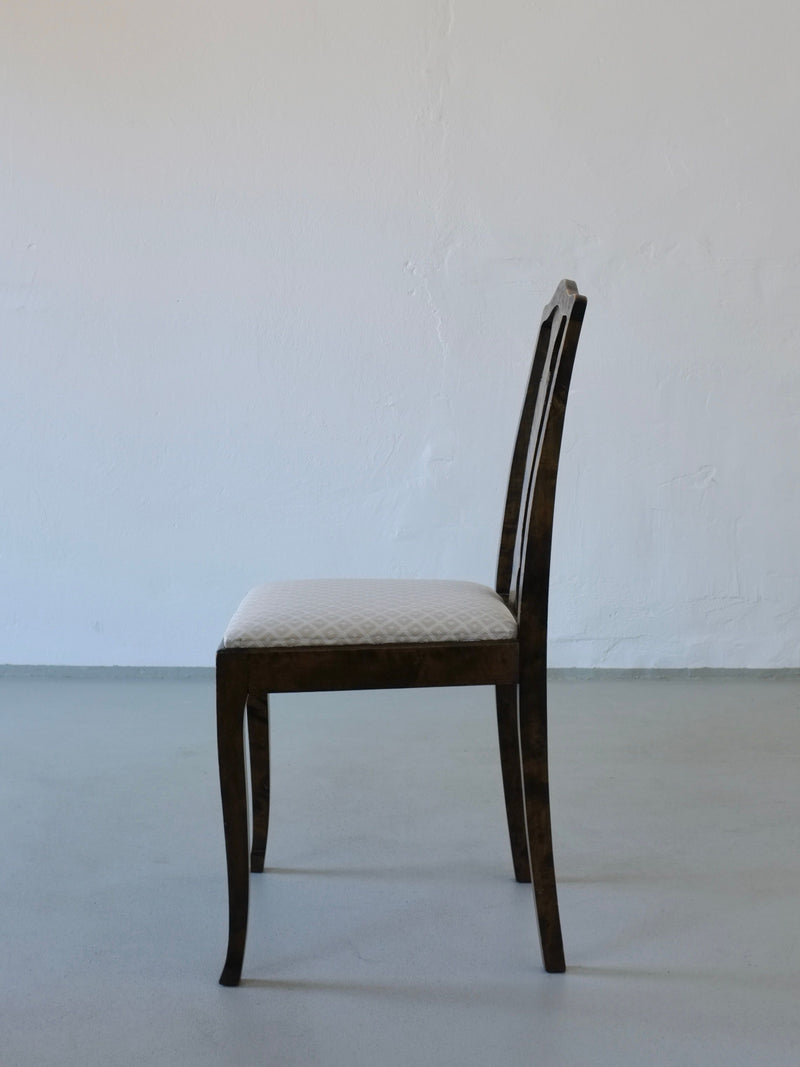 Side profile of Swedish Grace satin birch dining chair, 1920s
