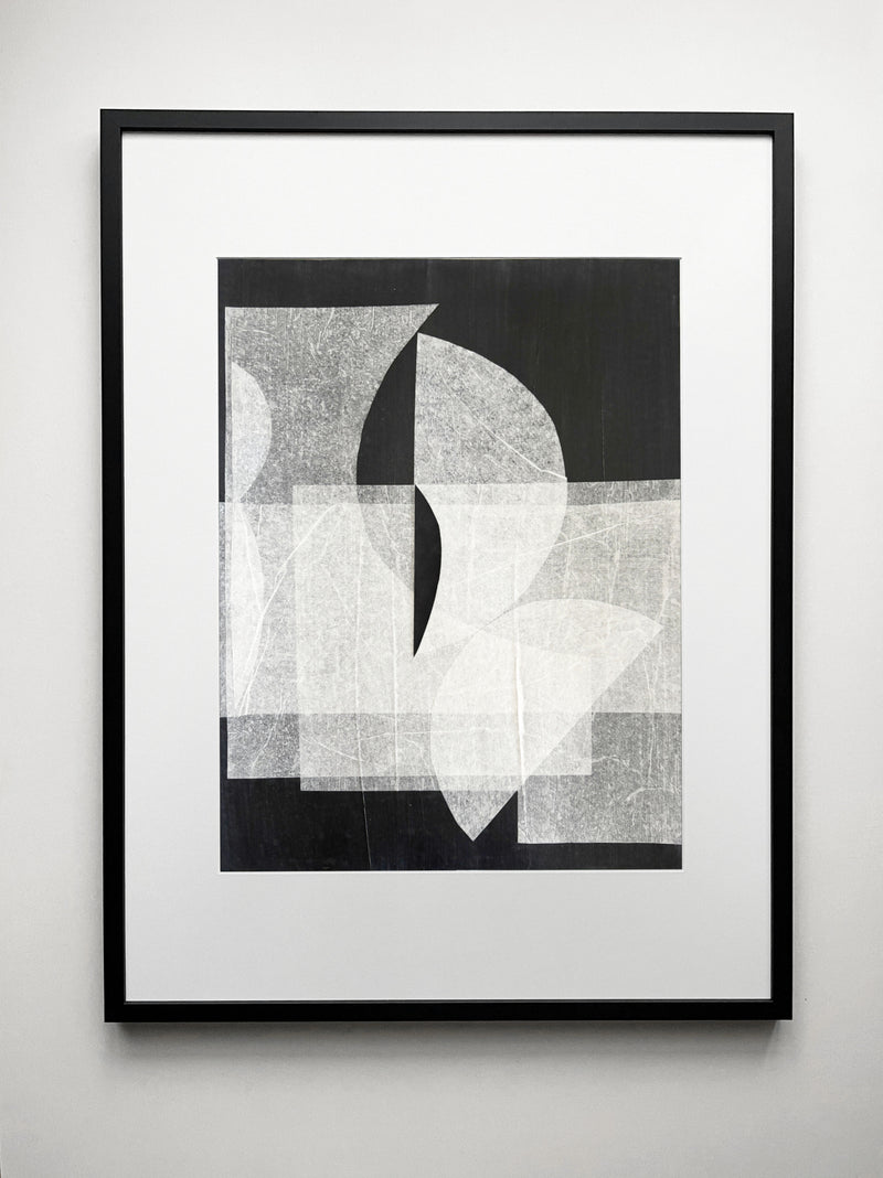 Abstract geometric drawing with overlapping white and gray shapes on black background
