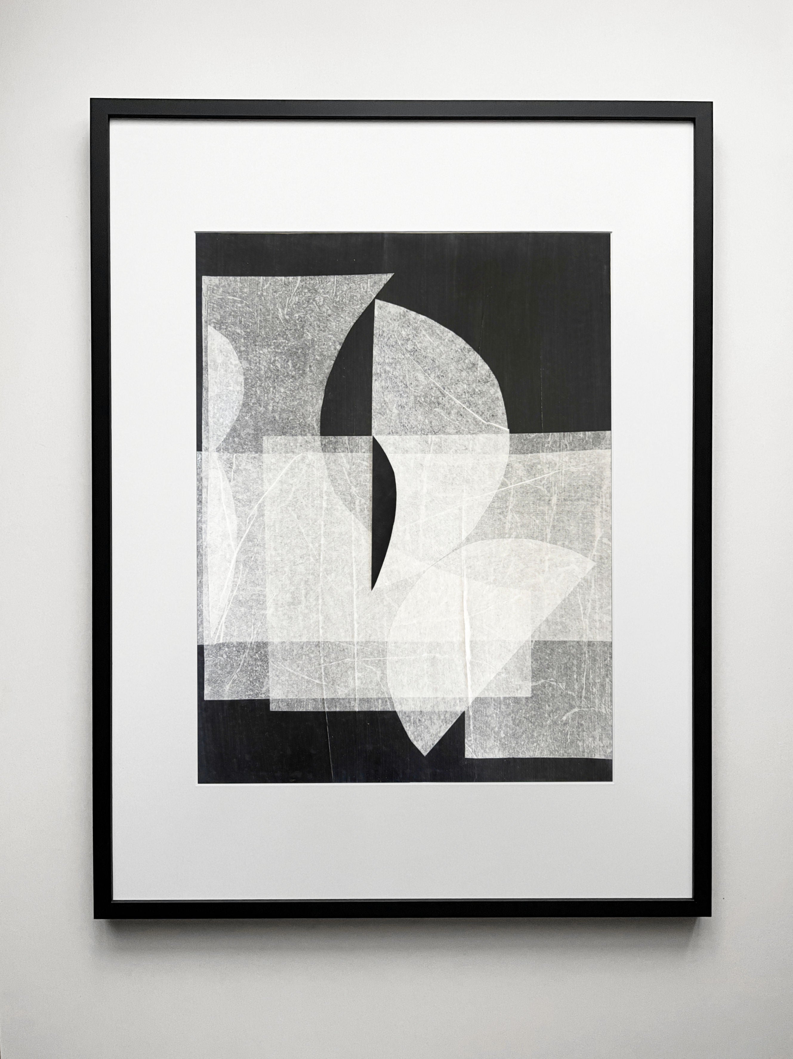 Abstract geometric drawing with overlapping white and gray shapes on black background