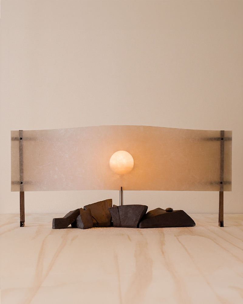 Sunrise table lamp with frosted glass shade and warm glowing orb