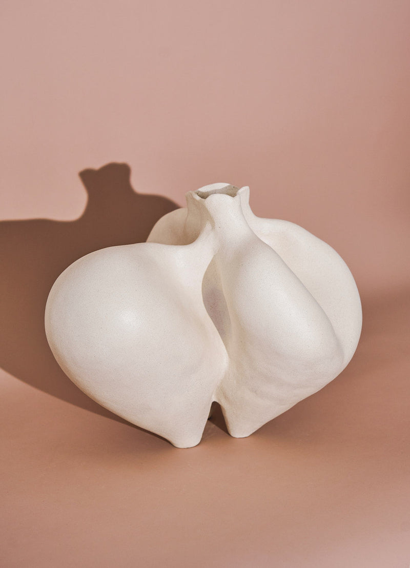 White ceramic vase with flowing curved form by Siham Djebbar