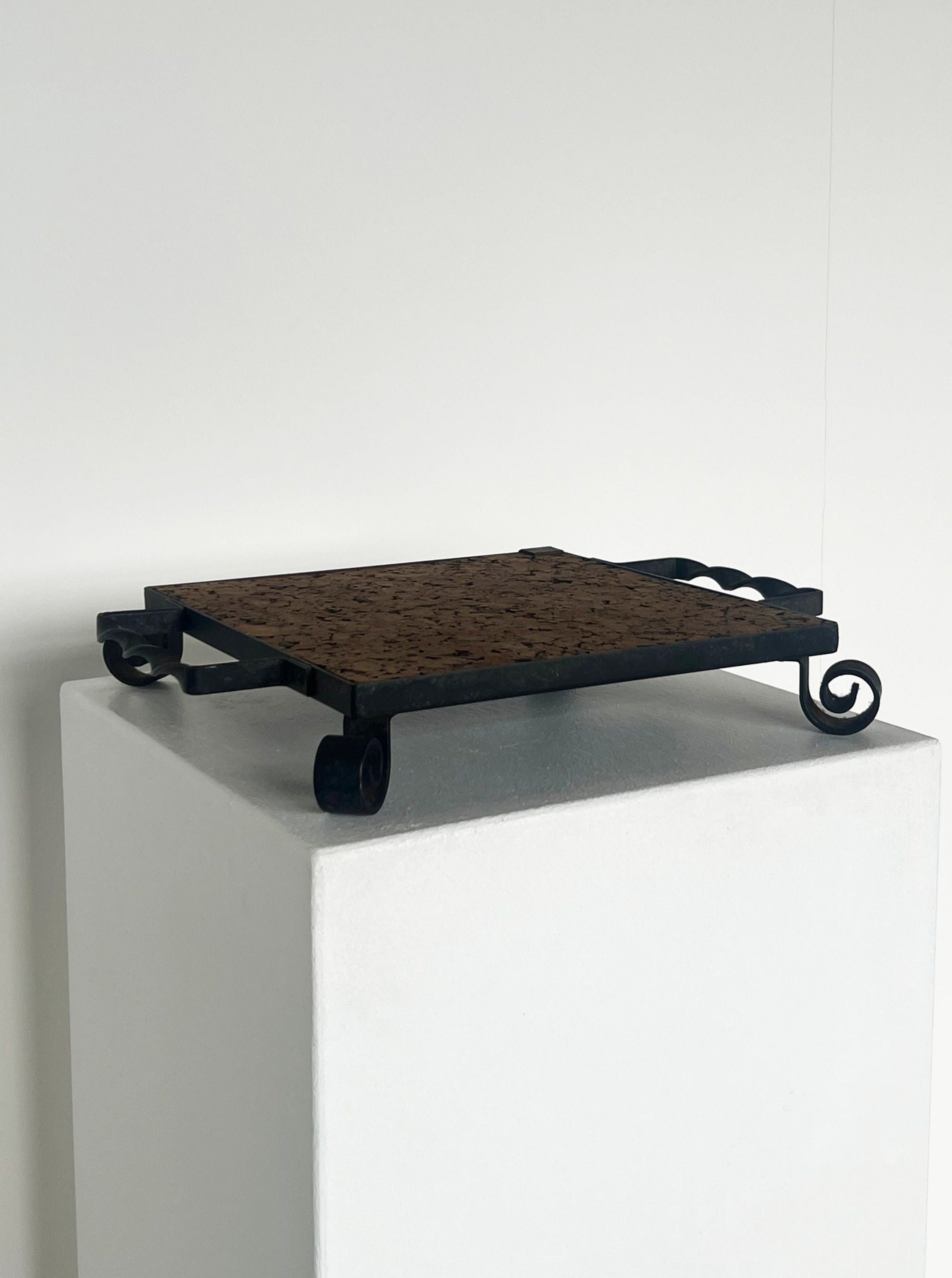 Cork and cast iron display plate with rustic wooden base and metal handle