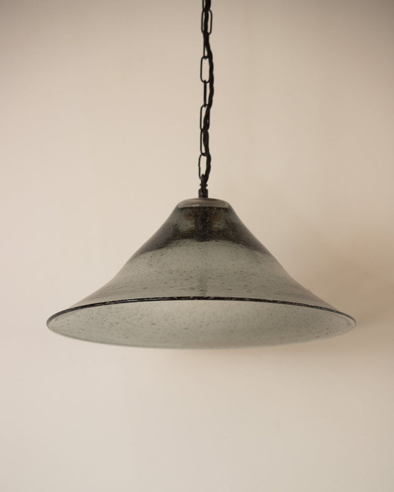 Seeded glass bell pendant light with dark chain suspension