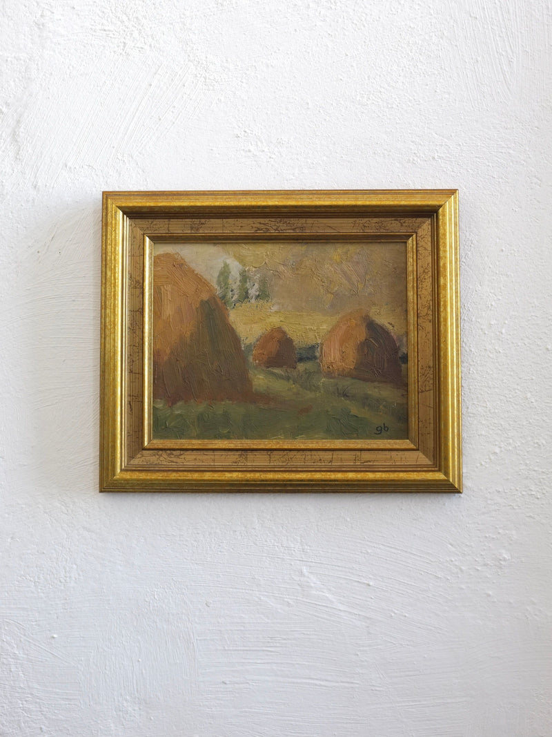 Small 1950s landscape oil painting with haystacks in golden frame