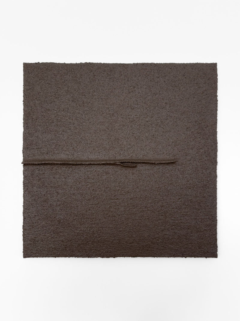 Shadow World 03 by Delal Salazar is a textured dark brown square artwork crafted with acrylic and sand on canvas, featuring a thin horizontal line and a small central protrusion, set against a plain white background.