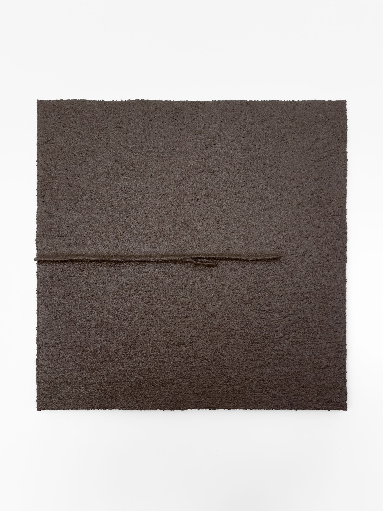 Shadow World 03 by Delal Salazar is a textured dark brown square artwork crafted with acrylic and sand on canvas, featuring a thin horizontal line and a small central protrusion, set against a plain white background.