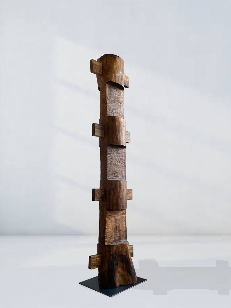 The 'Die Nacht' Sculpture by Eloi Schultz is a tall walnut totem with four rectangular panels and protruding horizontal blocks on a black base. Crafted with mortise and tenon joints, this piece can be made to order.