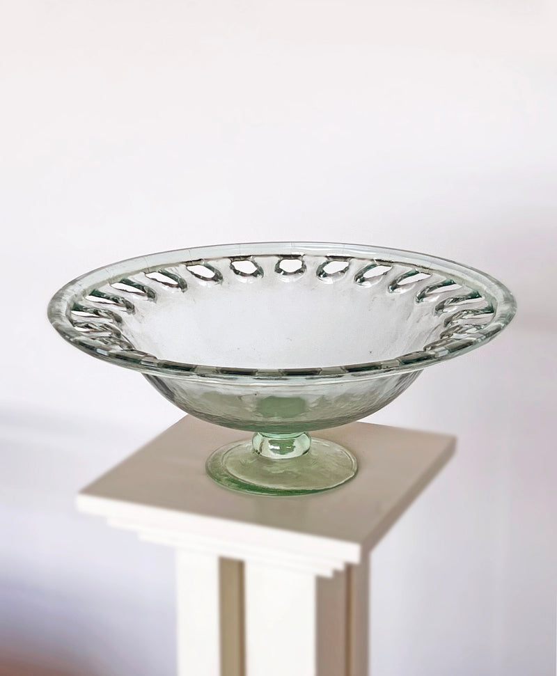 Clear glass footed bowl with decorative scalloped rim detail