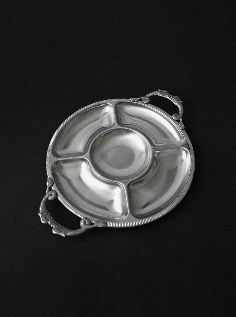 Round brushed stainless steel serving tray with ornate handles