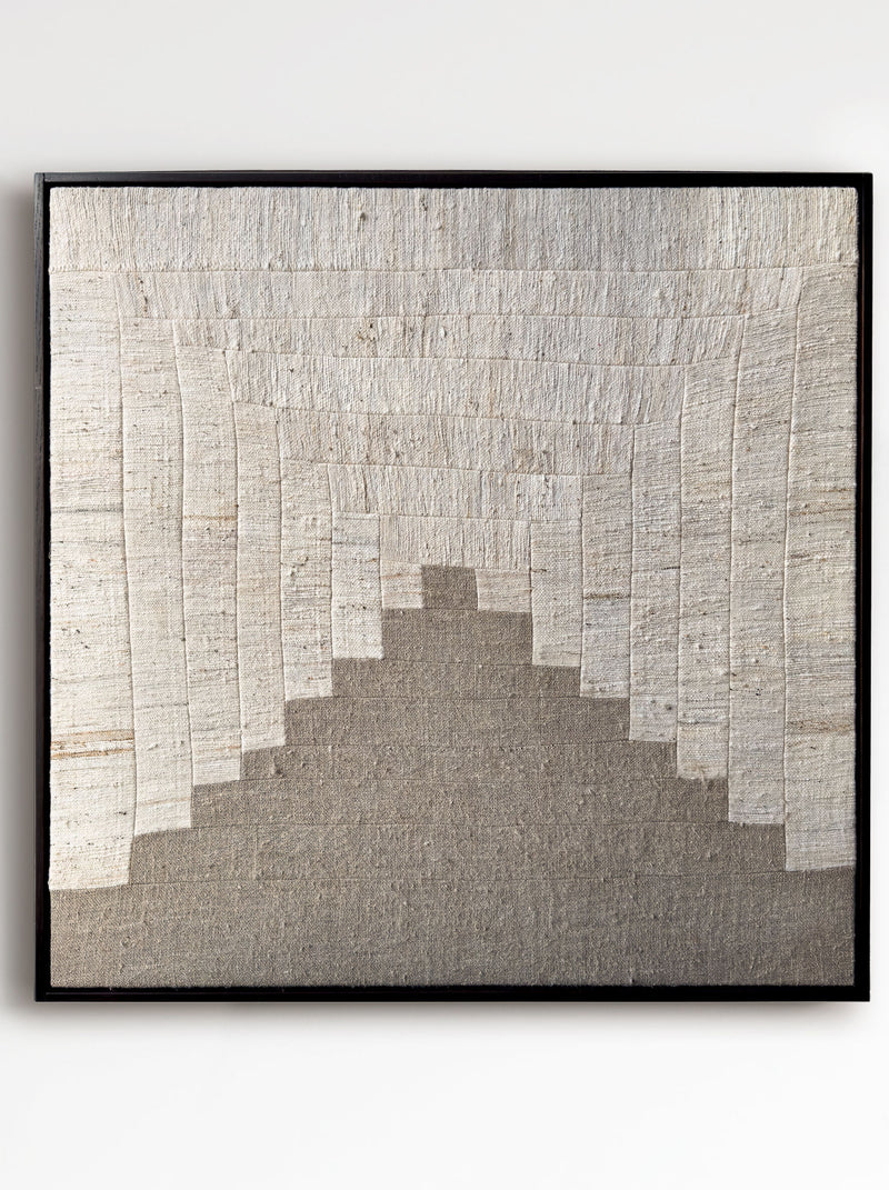 The "People's Hill" by Bec Kirby is a square textile wall art from 2025, featuring handwoven kapok fiber with cream vertical stripes atop a gray-brown textured bottom. Elegantly framed in solid oak, it presents a gradient design.